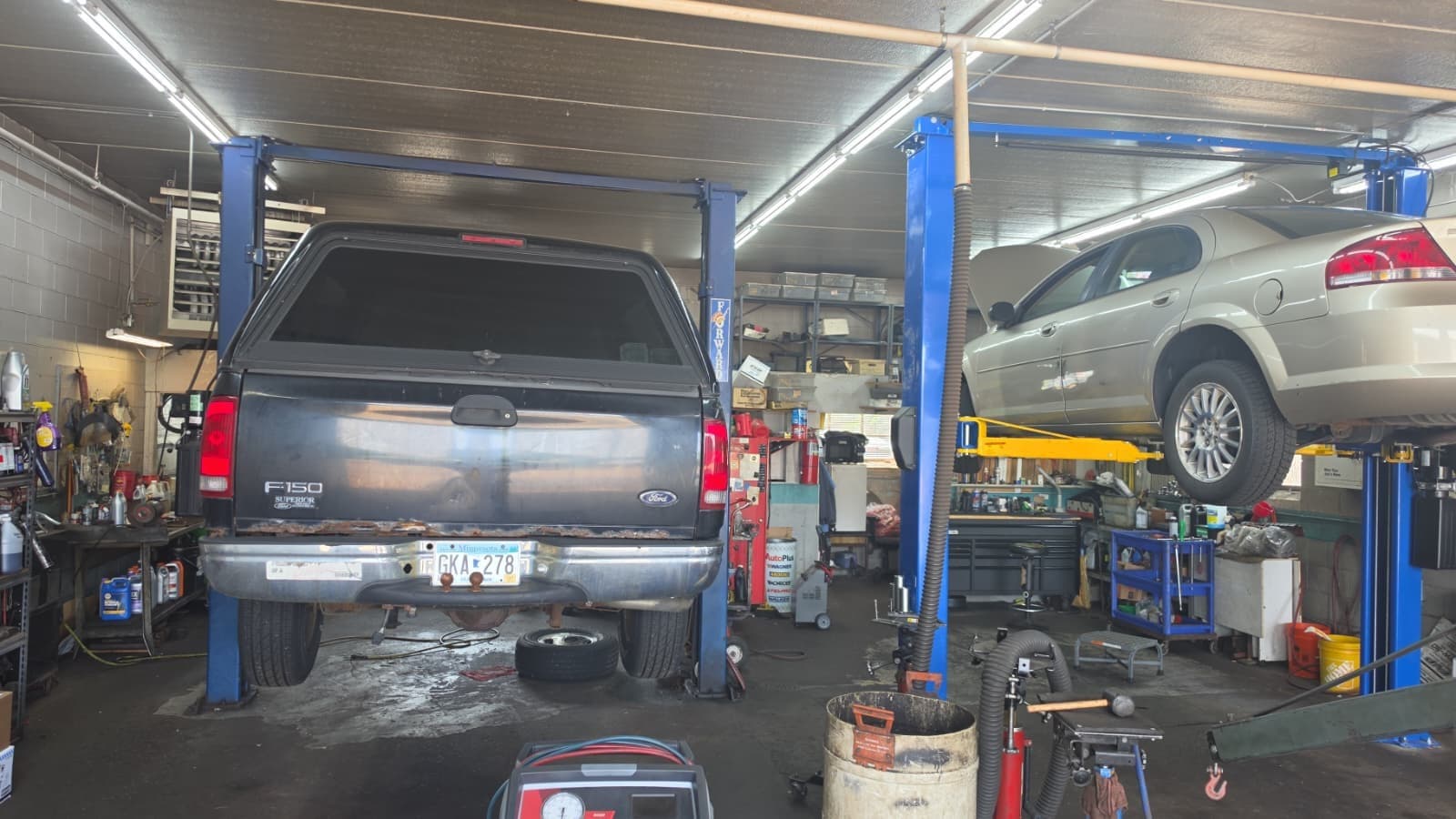B&R Auto Repair service bays with vehicles on lifts