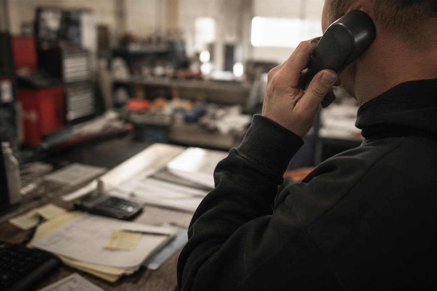 A call being taken at the shop counter